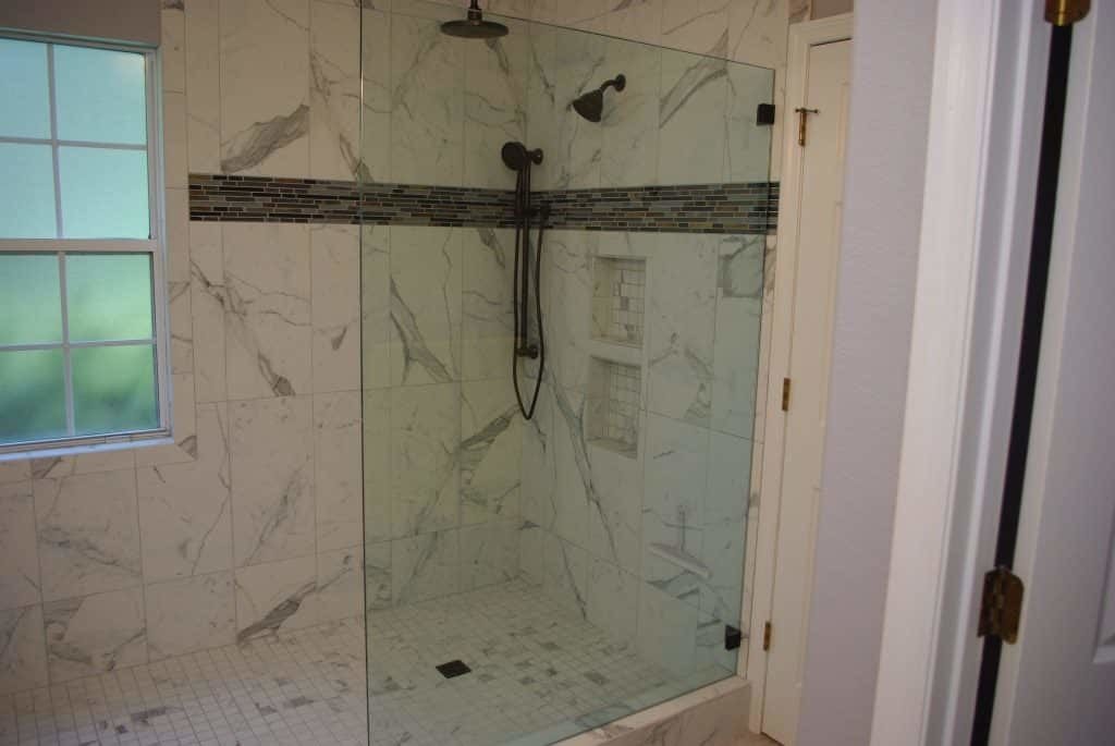 Marble shower with frameless glass