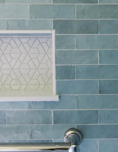 shower niche with white geometric tile accent – Hughes Bath