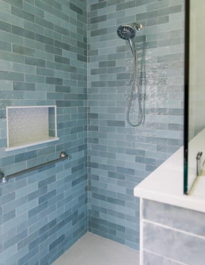 remodeling for retirement walk-in shower with blue tile and grab bar – Hughes Bath