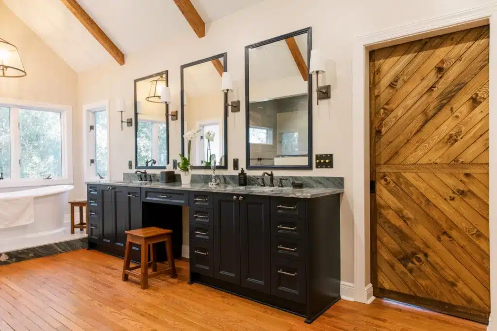 walk in closet remodel with connected bathroom featuring double vanity, wood beams, and soaking tub, Wilson project