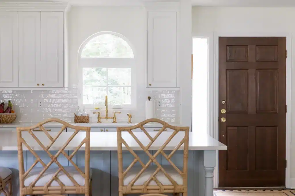 interior design principles. stools at kitchen island with arched window
