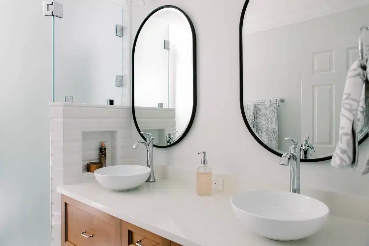 double small sink bathroom and vanity cabinet with double mirrors above
